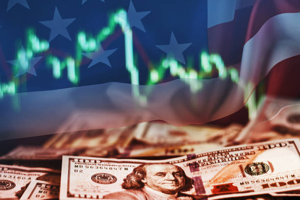 istock US dollar bills on a background with dynamics of exchange rates. 1212126588
