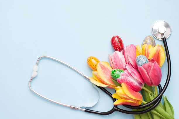istock Eggs with stethoscope and flowers on blue background. copy space , medicine easter 1212127142