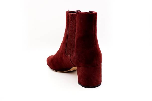 istock Burgundy red felt and leather boots 1212127303