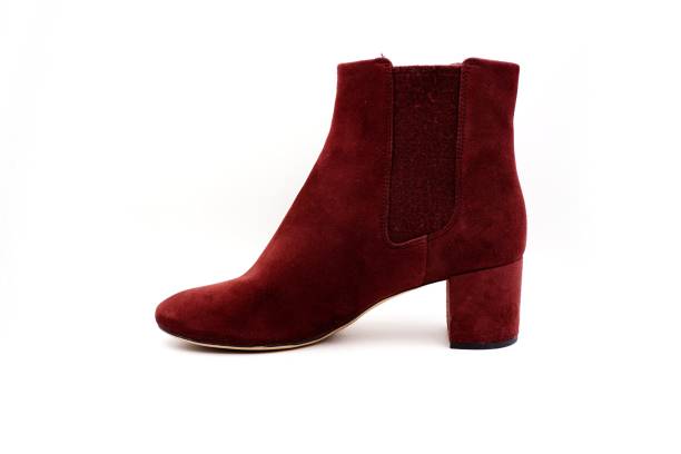 istock Burgundy red felt and leather boots 1212127349