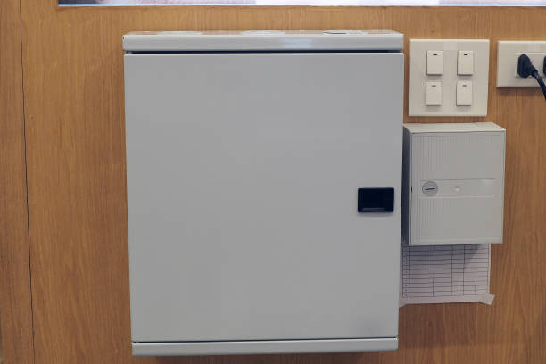istock Electric control panel power supply boxes on wooden wall background. 1212127393