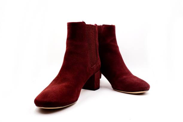 istock Burgundy red felt and leather boots 1212127690