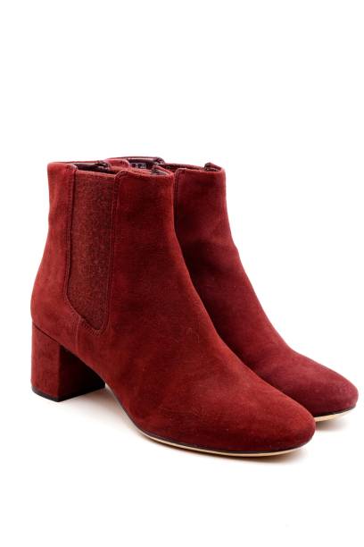 istock Burgundy red felt and leather boots 1212128783