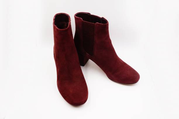 istock Burgundy red felt and leather boots 1212129102