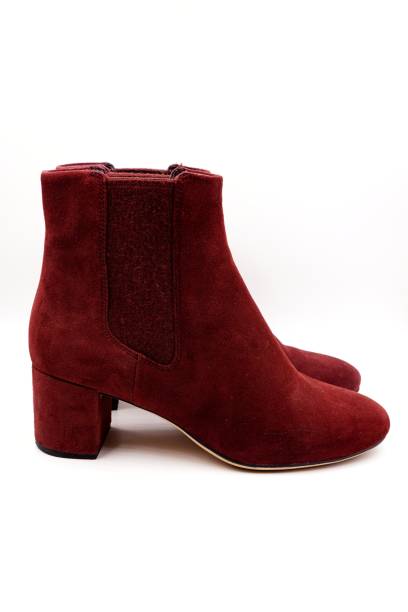 istock Burgundy red felt and leather boots 1212129130