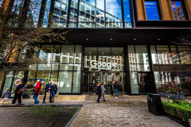 Exterior of Google office Headquarters in London, UK London, UK - 27 February, 2020: color image depicting the glass and steel exterior of the Google offices near King's Cross railway station in London, UK. People and tourists walk past on the street in the foreground. big tech stock pictures, royalty-free photos & images