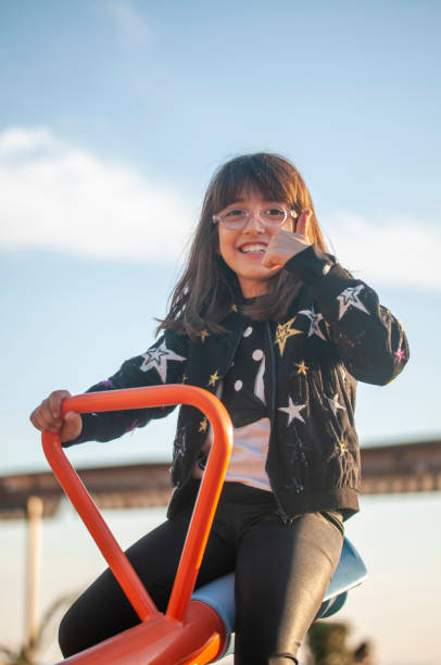 istock Cute girl tired on seesaw 1212135950