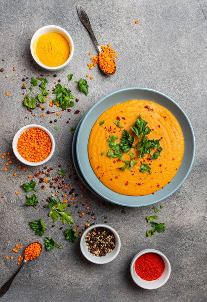 Indian dal. Traditional Indian soup lentils. Indian Dhal spicy curry in bowl, spices, herbs, rustic grey wooden background. Authentic Indian dish. Top view. Indian dal. Traditional Indian soup lentils. Indian Dhal spicy curry in bowl, spices, herbs, rustic grey wooden background. Authentic Indian dish. Top view soup lentil healthy eating dishware stock pictures, royalty-free photos & images