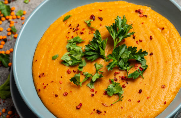 istock Indian Dhal spicy curry in bowl, spices, herbs, rustic grey wooden background. Authentic Indian dish. Macro 1212136127