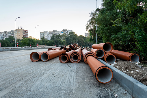 Pvc Pipeline stacked on the road, road construction with pipes