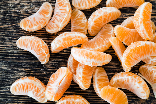 juicy fresh slices of fresh ripe and sweet oranges on the table, close-up of citrus fruits