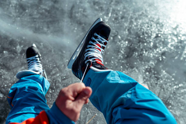 istock Lacing up the ice skates, first person view 1212141694