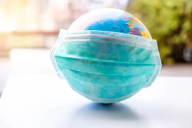Photo of Globe with a face mask