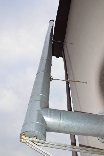 istock Chimney for removing smoke from the stove in  house 1212142777