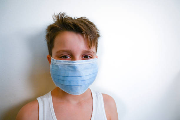 istock Corona Virus - Child with Face Mask 1212143255