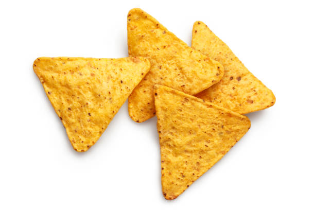 вкусные чипсы начос на белом - nachos yellow white spice стоковые фото и изображения