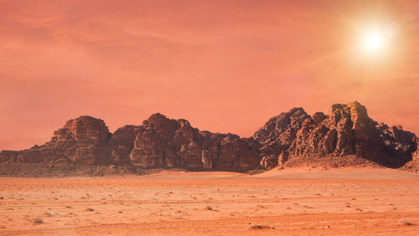 Planet Mars like landscape - Photo of Wadi Rum desert in Jordan with red colour filter and added sun, this location was used as set for many science fiction movies Planet Mars like landscape - Photo of Wadi Rum desert in Jordan with red colour filter and added sun, this location was used as set for many science fiction movies. mars stock pictures, royalty-free photos & images