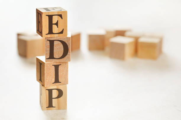 Four wooden cubes arranged in stack with letters EDIP meaning Explain, demonstrate, imitate, practice on them, space for text image at down right corner