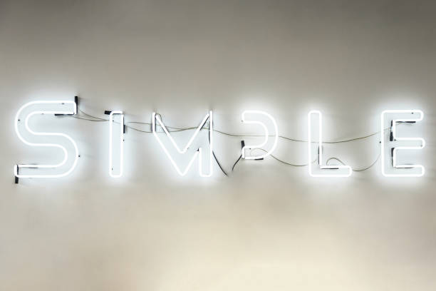 istock neon burning lettering simple on a beige background 1212147571