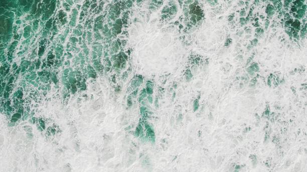 istock huge turquoise ocean waves on foamy surface aerial view 1212148644