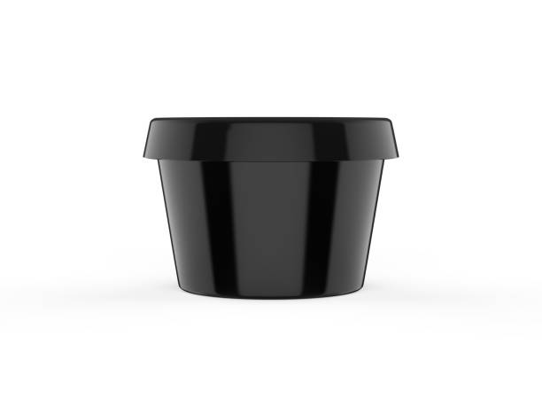 istock Round black plastic container for butter, cosmetics cream or margarine spread, mockup template on isolated white background, 3d illustration. 1212148764