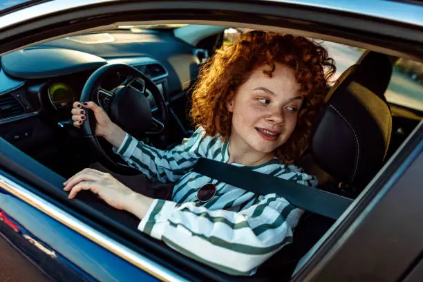 Photo of Female driver looking over shoulder