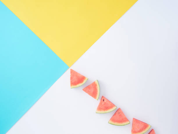 istock Watermelon slice on colorful background with space for text, minimal style concept. 1212149111