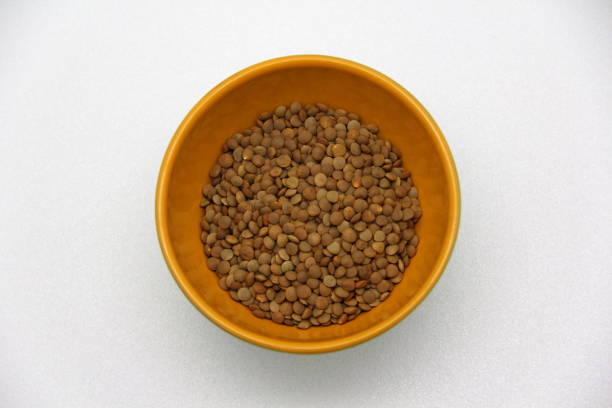 istock Ceramic bowl with lentils on a white background, top view 1212150384