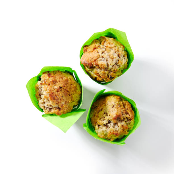 istock Three Muffins or Cupcakes in Green Paper Isolated 1212151806
