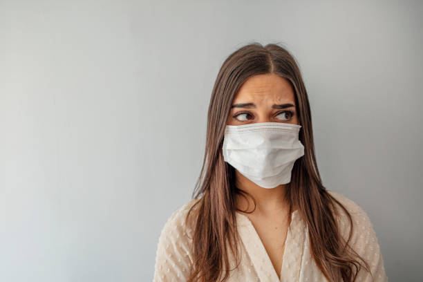 istock Young woman with face mask 1212152203