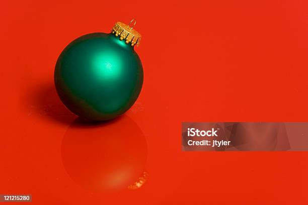 Green Ornament On Red Stock Photo - Download Image Now - Christmas, Christmas Ornament, Color Image