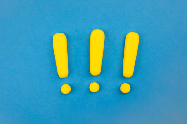 Three spaced vivid exclamation marks on blue background.  Keep attention concept,  importance background, warning. Warning sign, vivid color, model on blue background, view from above. Warning concept. Artificial, three dimensional exclamation point. pop art photos stock pictures, royalty-free photos & images