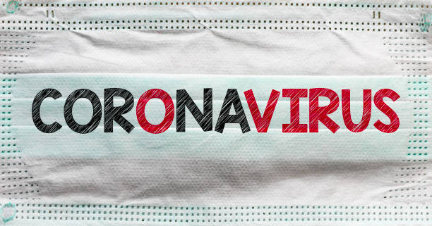istock protective mask and coronavirus text. New Coronavirus-2019-nCoV. COVID-19 outbreak. 1212153596