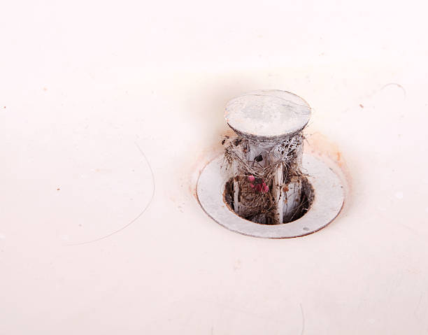 istock Nasty Dirty Hair Clog Pulled out with Sink Stopper 121215764