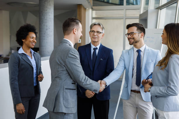 istock Successful business executives shaking hands with each other 1212157700