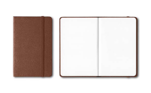 istock Dark leather closed and open notebooks isolated on white 1212159146