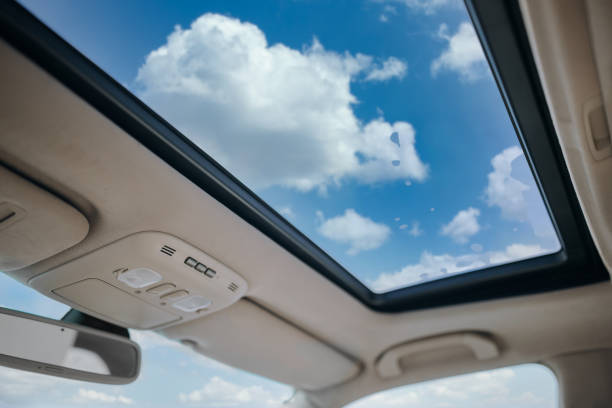 istock Panoramic glass sun roof in the car 1212161891