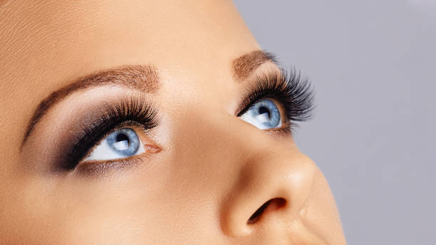 istock Woman face with long eyelashes and smokey eyes make-up 1212163394