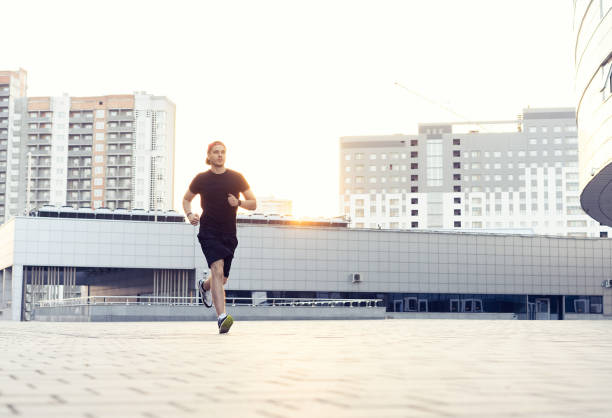 istock Fit athlete running outdoors to stay healthy 1212164414