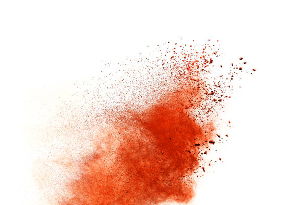 абстрактный взрыв оранжевого порошка изолирован на белом фоне. - powder make up стоковые фото и изображения