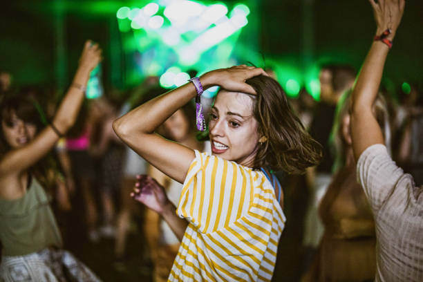 istock Happy woman having fun while dancing on music concert. 1212165722