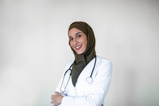 istock Arab doctor woman posing confident with folded arms 1212168141