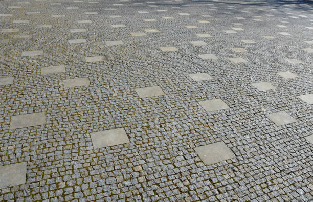 istock granite cobblestone tiles in a large area and inside cut irregularly placed cut stone slabs gray 1212170142