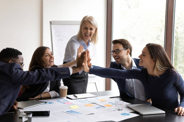 istock Motivated diverse businesspeople engaged in teambuilding activity at briefing 1212172553