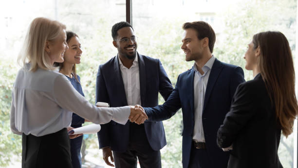 istock Diverse businesspeople handshake getting acquainted in office 1212172559