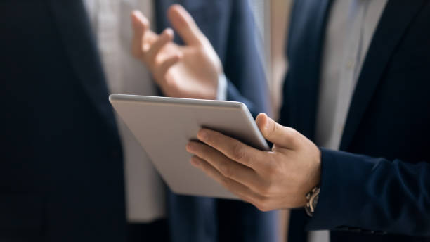 istock Confident businessman use modern tablet with wireless internet 1212172570