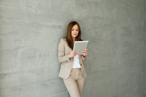 istock Professional businesswoman looking at digital tablet 1212173738