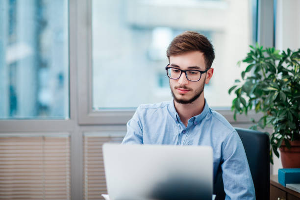 istock Young businessman in office 1212174196