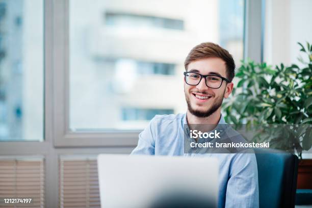 Young Businessman In Office Stock Photo - Download Image Now - Office, Young Adult, Men