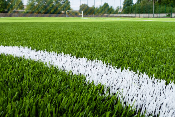 istock Artificial green grass on the football field 1212175033
